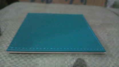 Elegant turquoise leather tea coaster with a sleek design for home and kitchen use