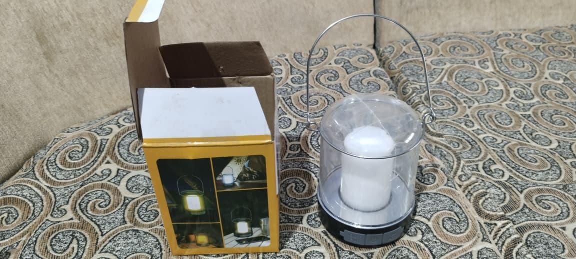 LED rechargeable camping lantern with clear design and sturdy handle, ideal for outdoor adventures