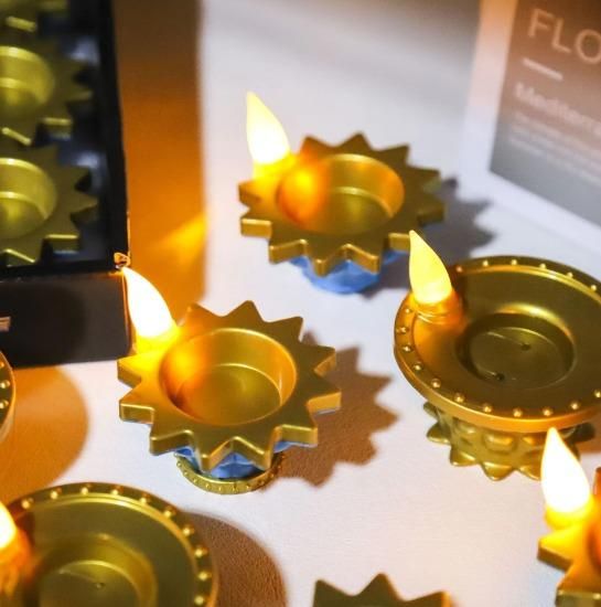 Gold LED water pouring diya light with flickering flame-like effects for festive decorations