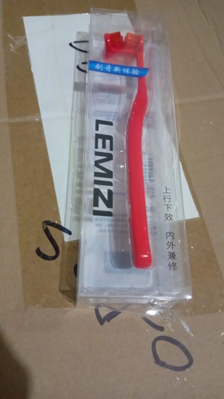 Your Brand six sided soft toothbrush in red packaging for gentle oral care