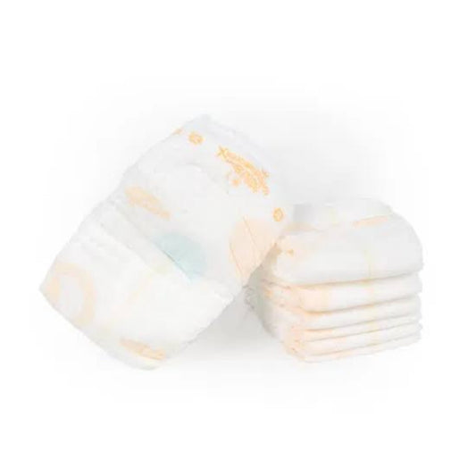 Stack of white organic baby diapers XL from THE GIR FARMER, perfect for gentle skin protection