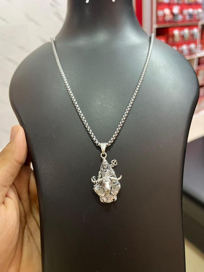 Lord Shiva silver pendant on a sleek chain displayed on a black bust for jewelry showcase