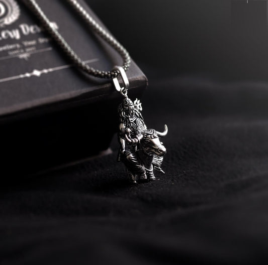 Lord Shiva silver pendant featuring intricate design with a bull motif on a sleek chain