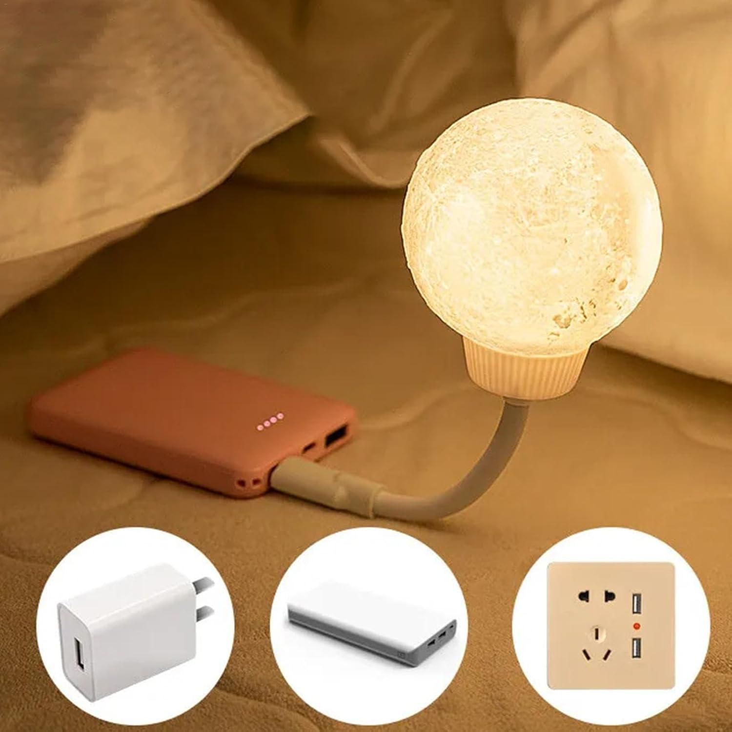 Warm glowing 3D moon lamp for home decor on flexible USB stand plugged into power bank on bed