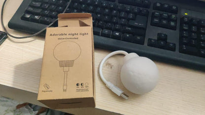 White spherical USB moon light with cord and box on desk next to keyboard 3D moon lamp for home decor