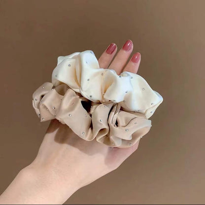 Luxury silk scrunchie for women in cream and beige colors with small decorative beads