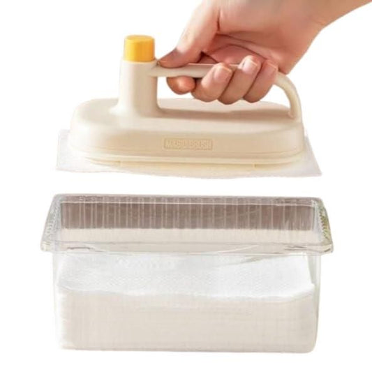 Hand holding beige disposable cleaning brush with handle over clear plastic dispenser of cleaning pads