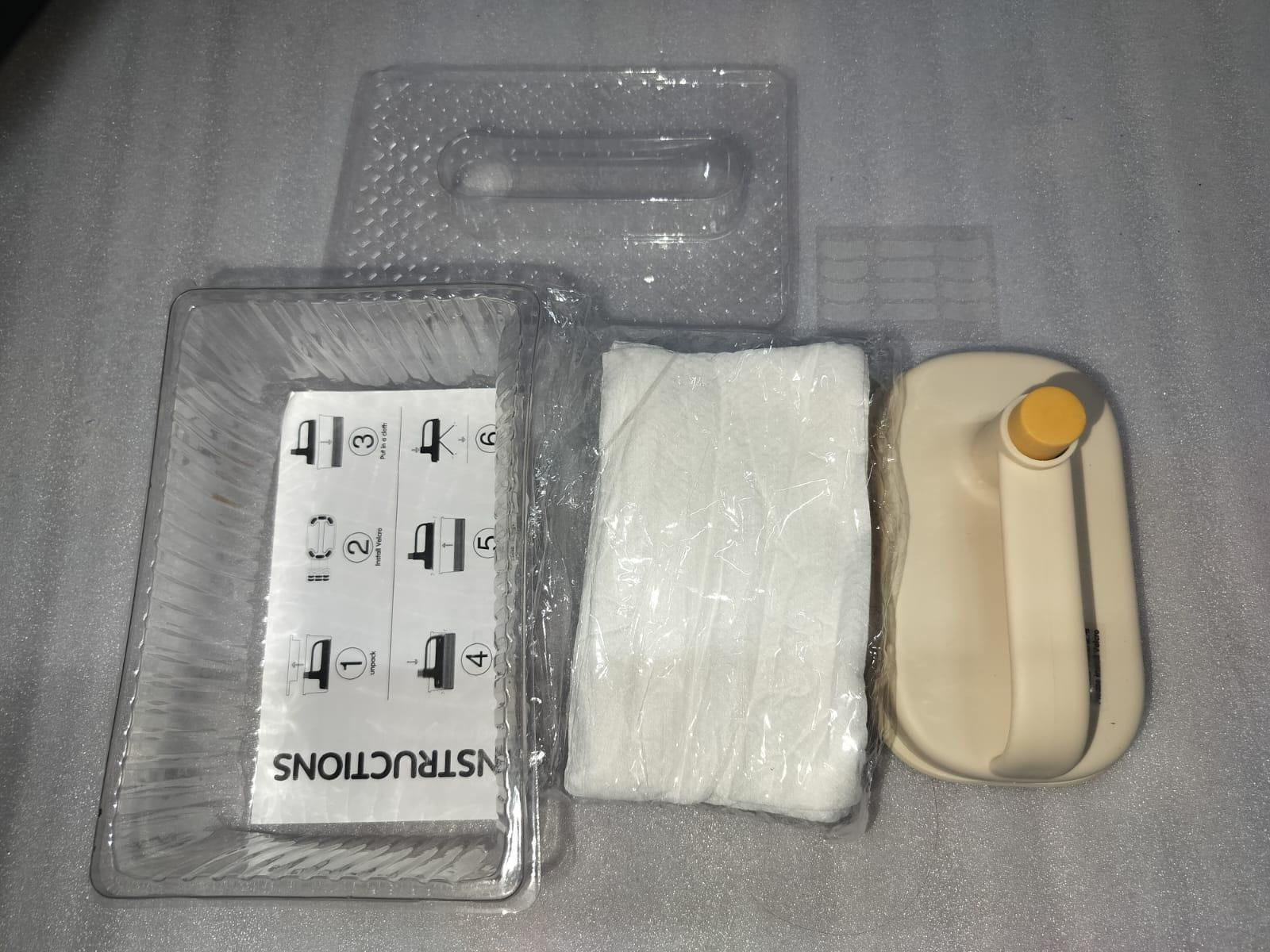 Disposable cleaning brush with handle kit showing beige handle and plastic trays and wrapped white pads