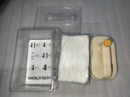 Disposable cleaning brush with handle kit showing beige handle and plastic trays and wrapped white pads