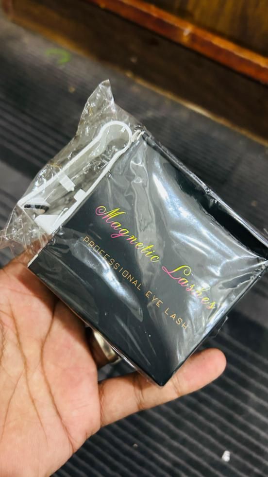 Magnetic eyelashes pair in packaging with applicator tool for easy use and professional results