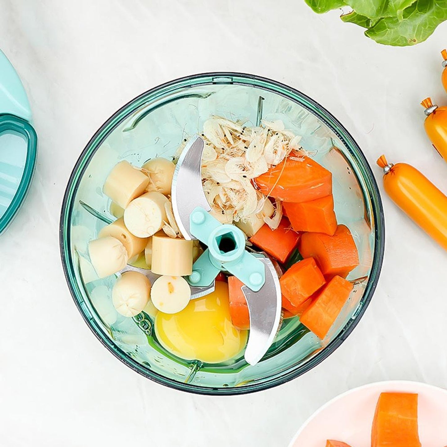 Manual stainless steel vegetable chopper with diced vegetables and a stainless steel blade for efficient cutting
