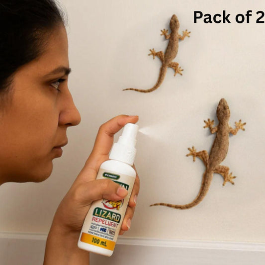 Woman using THE GIR FARMER chemical-free lizard control spray to repel lizards on wall pack of 2 bottles