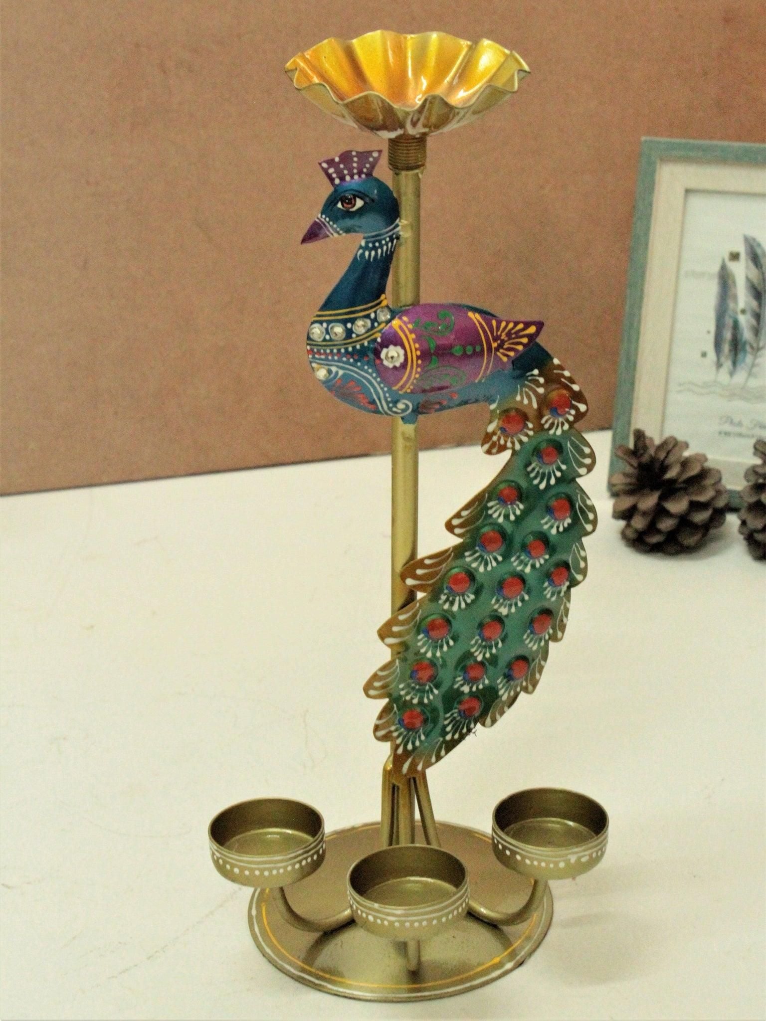 Colorful metal peacock tea light stand with three holders and decorative tail feathers