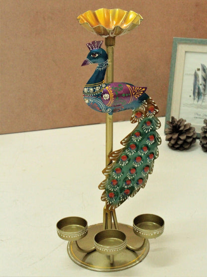 Colorful metal peacock tea light stand with three holders and decorative tail feathers