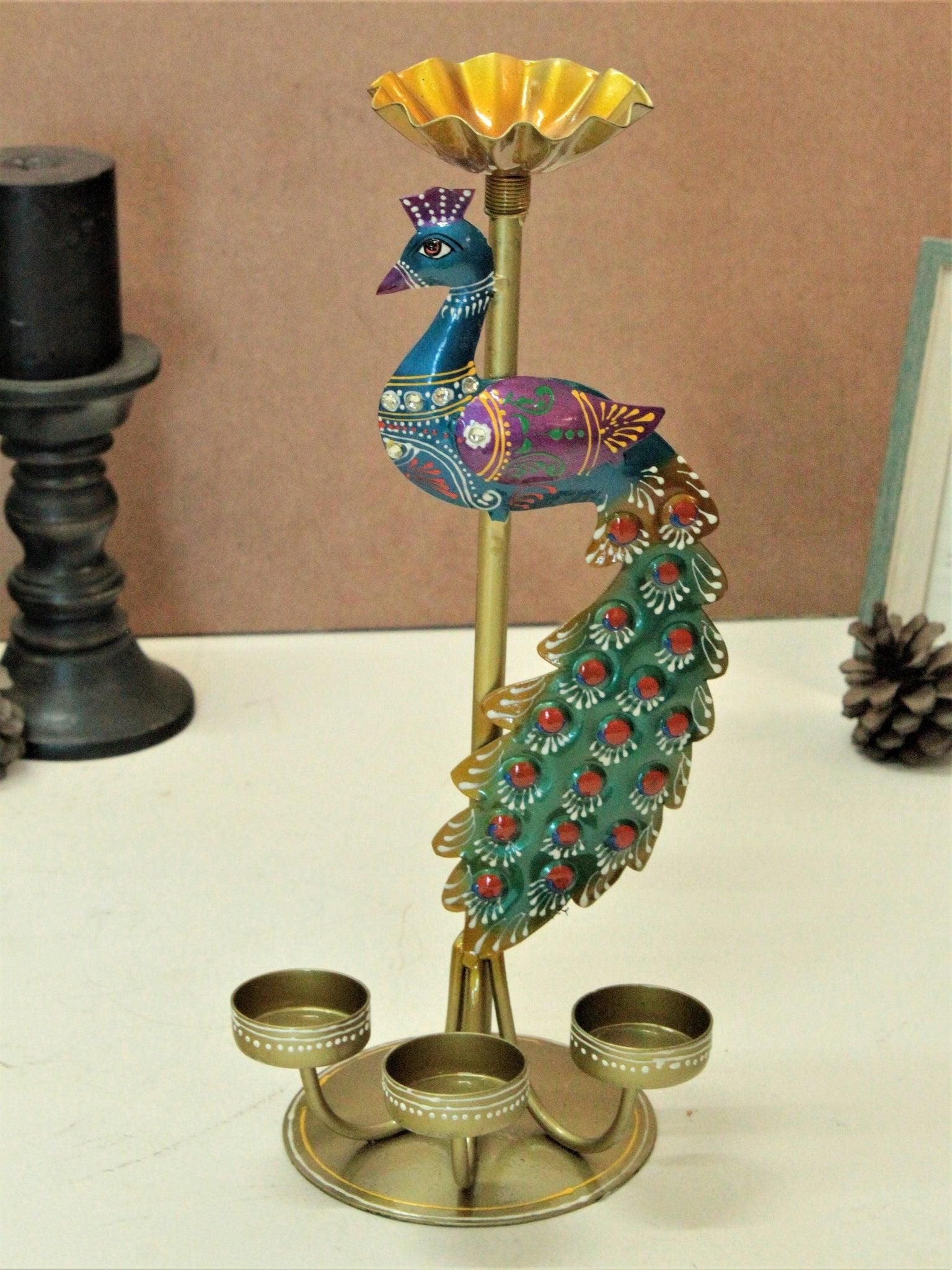 Colorful metal peacock tea light stand with detailed design and three candle holders by THE GIR FARMER