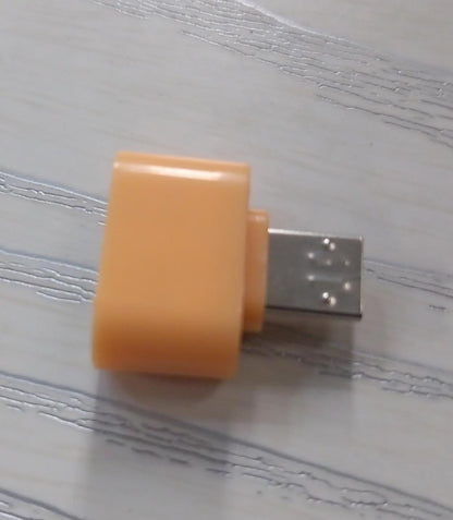 Micro USB OTG adapter for Android in a compact orange design for easy connectivity