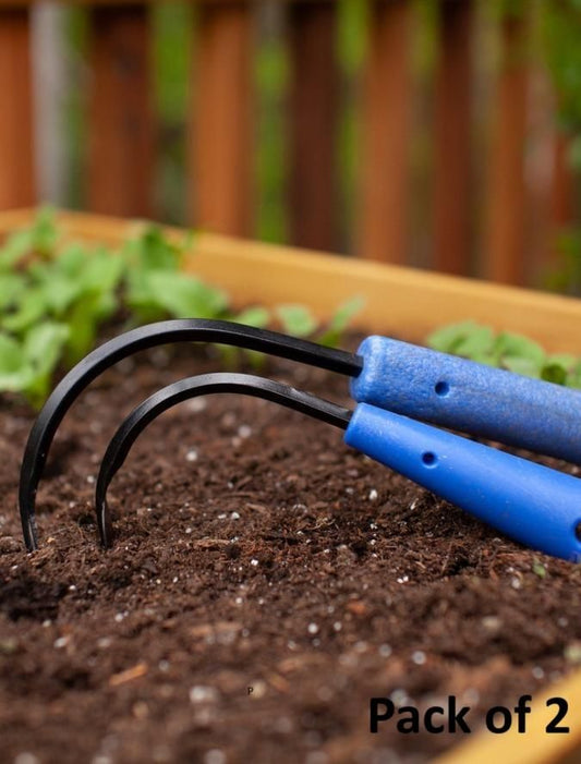 Mini weeder pack for raised beds with two blue-handled gardening tools on soil