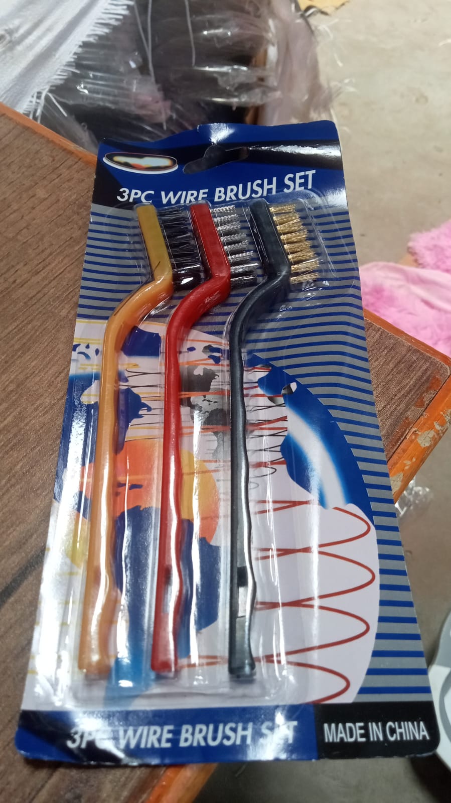 Mini wire brush set with three brushes in red, yellow, and black for precise cleaning in various applications
