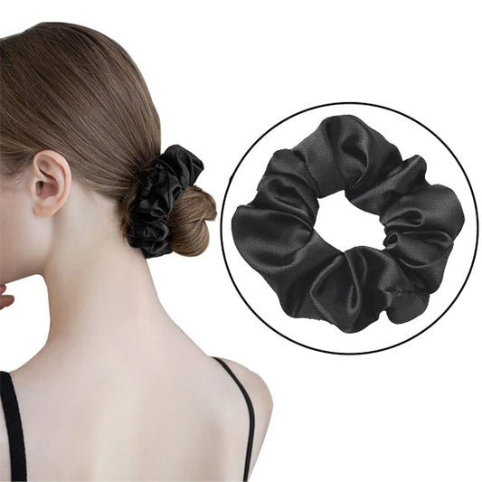 Black mulberry silk elastic band for hair worn on a brown bun and shown separately