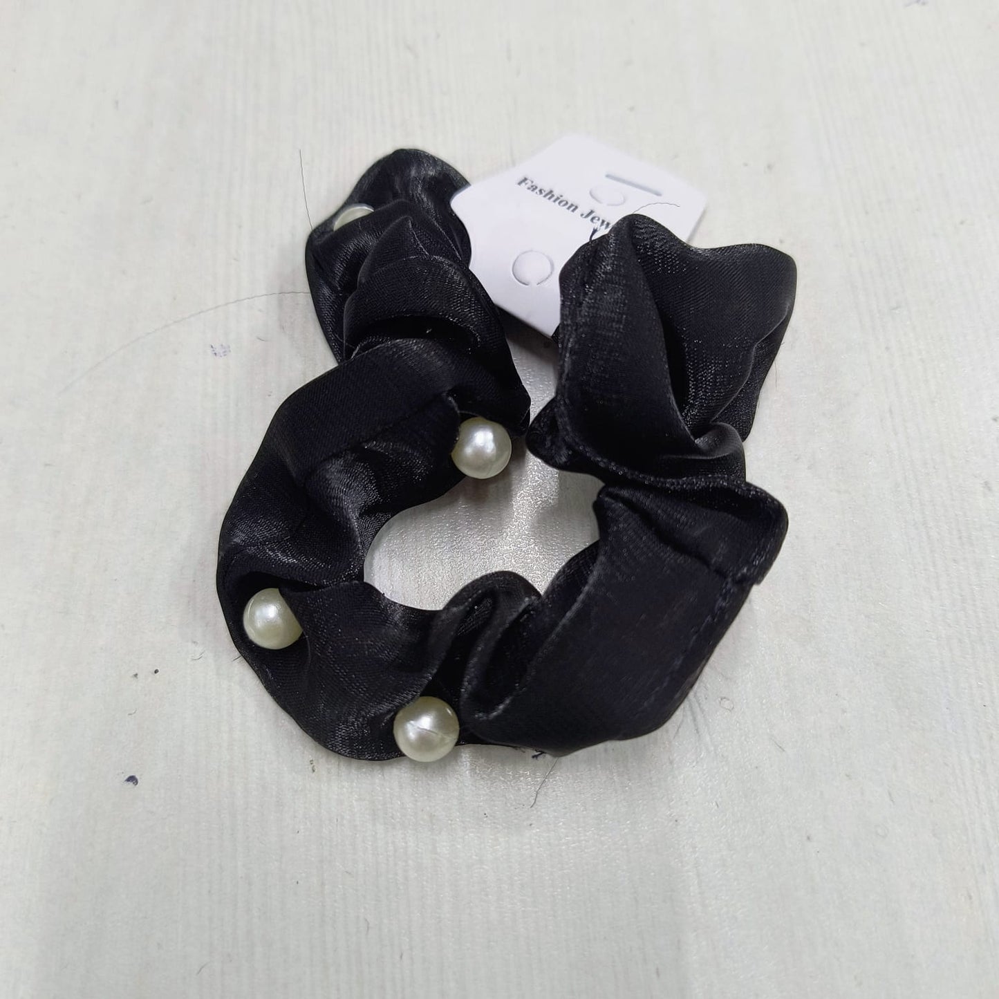 Black mulberry silk scrunchies with pearl accents by Amd DeoDap on white background