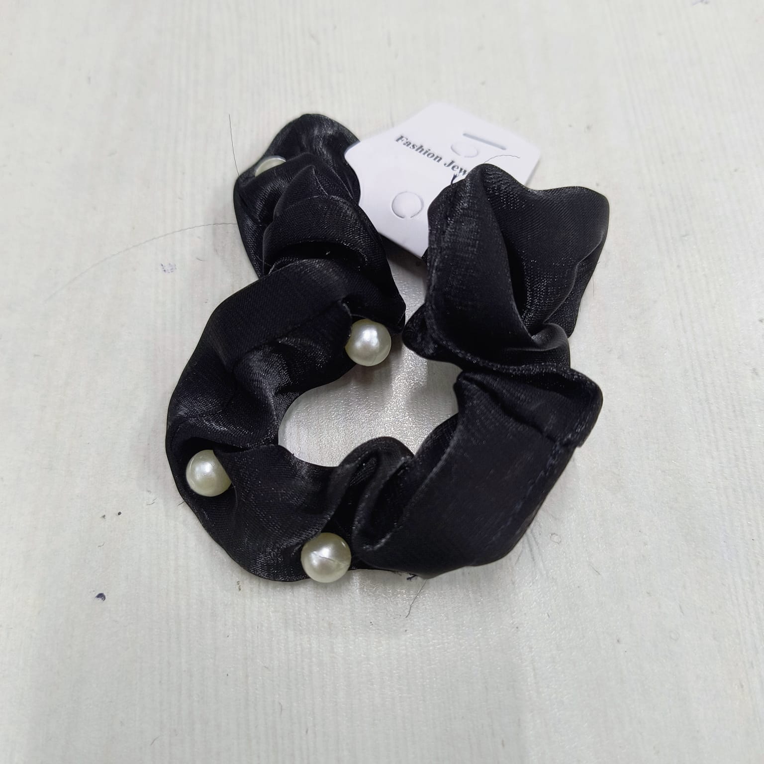 Black mulberry silk scrunchies with pearl accents by Amd DeoDap on white background
