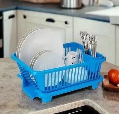 Blue multi-functional dish drying rack holding plates, cups, and silverware on kitchen countertop