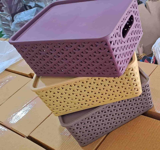 THE GIR FARMER multipurpose storage basket with lid in purple beige and brown stacked on cardboard boxes