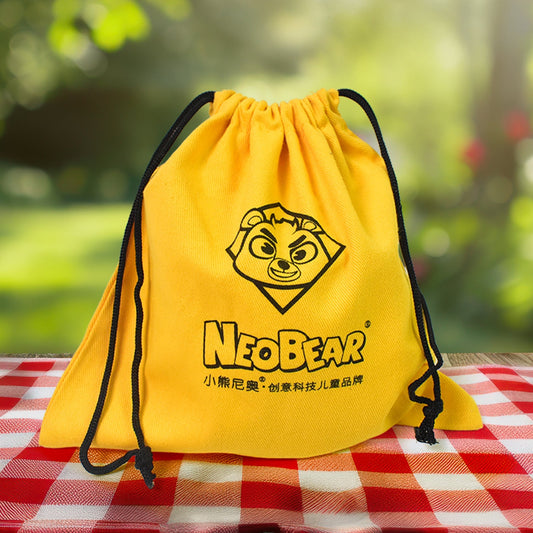 Heavy duty small dori bag in yellow with drawstring closure and NeoBear logo