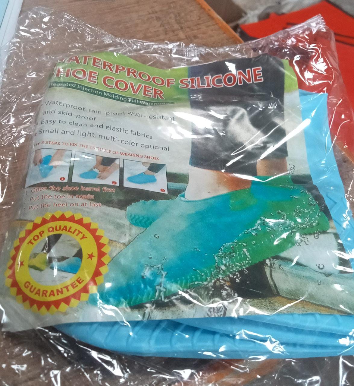 Waterproof non-slip silicone shoe covers in packaging for protection against water and dirt