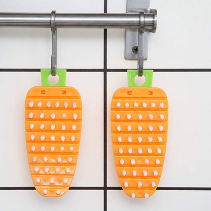 Set of two non-toxic vegetable scrubbing brushes in orange with green handles for safe cleaning