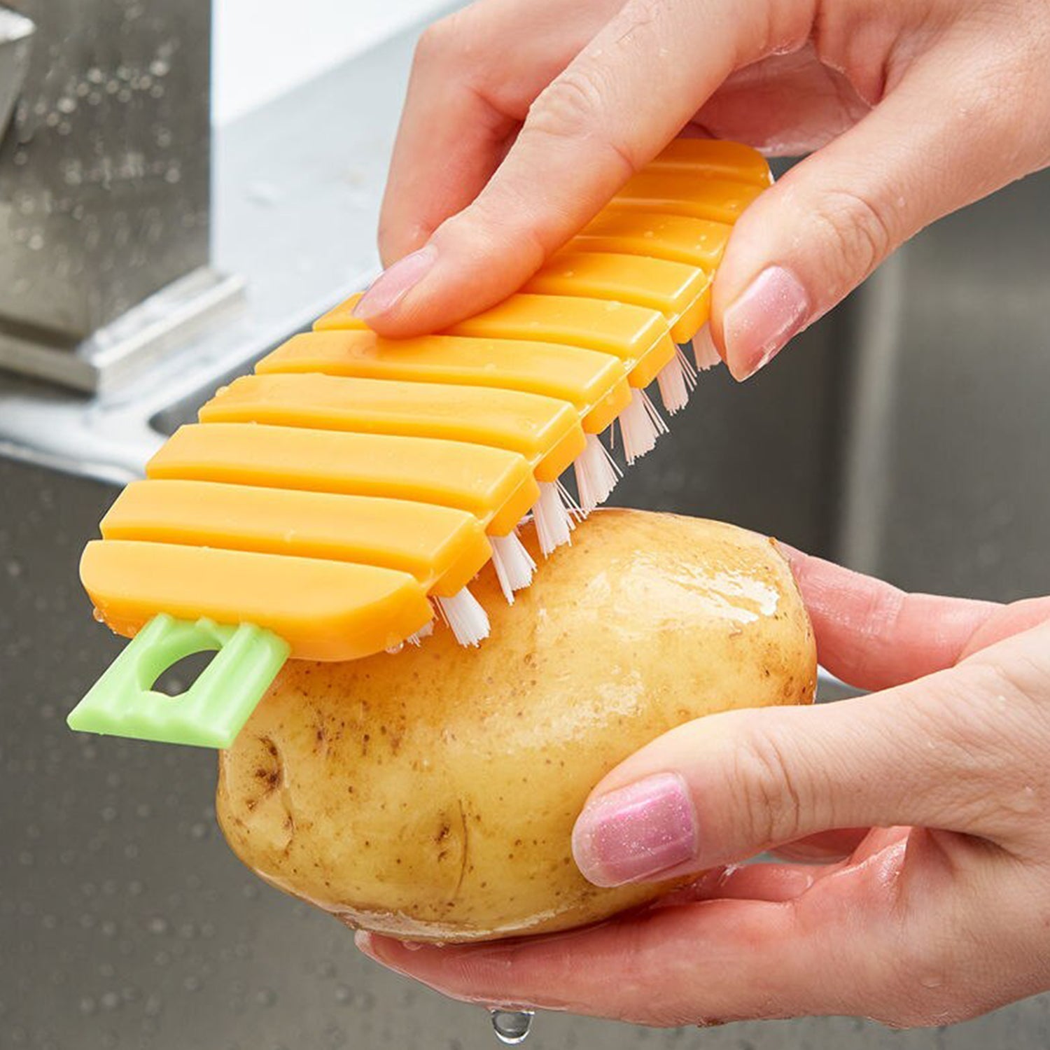 Non-toxic vegetable scrubbing brush used for cleaning potatoes in the kitchen sink