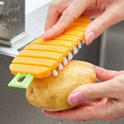 Non-toxic vegetable scrubbing brush used for cleaning potatoes in the kitchen sink