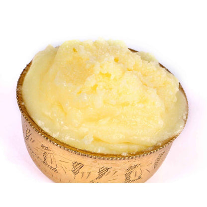 Creamy yellow organic ghee in a decorative bowl, perfect for cooking and adding flavor to dishes