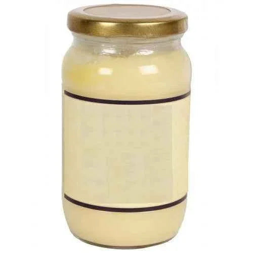 Glass jar of organic ghee from The Gir Farmer, creamy and perfect for cooking or baking