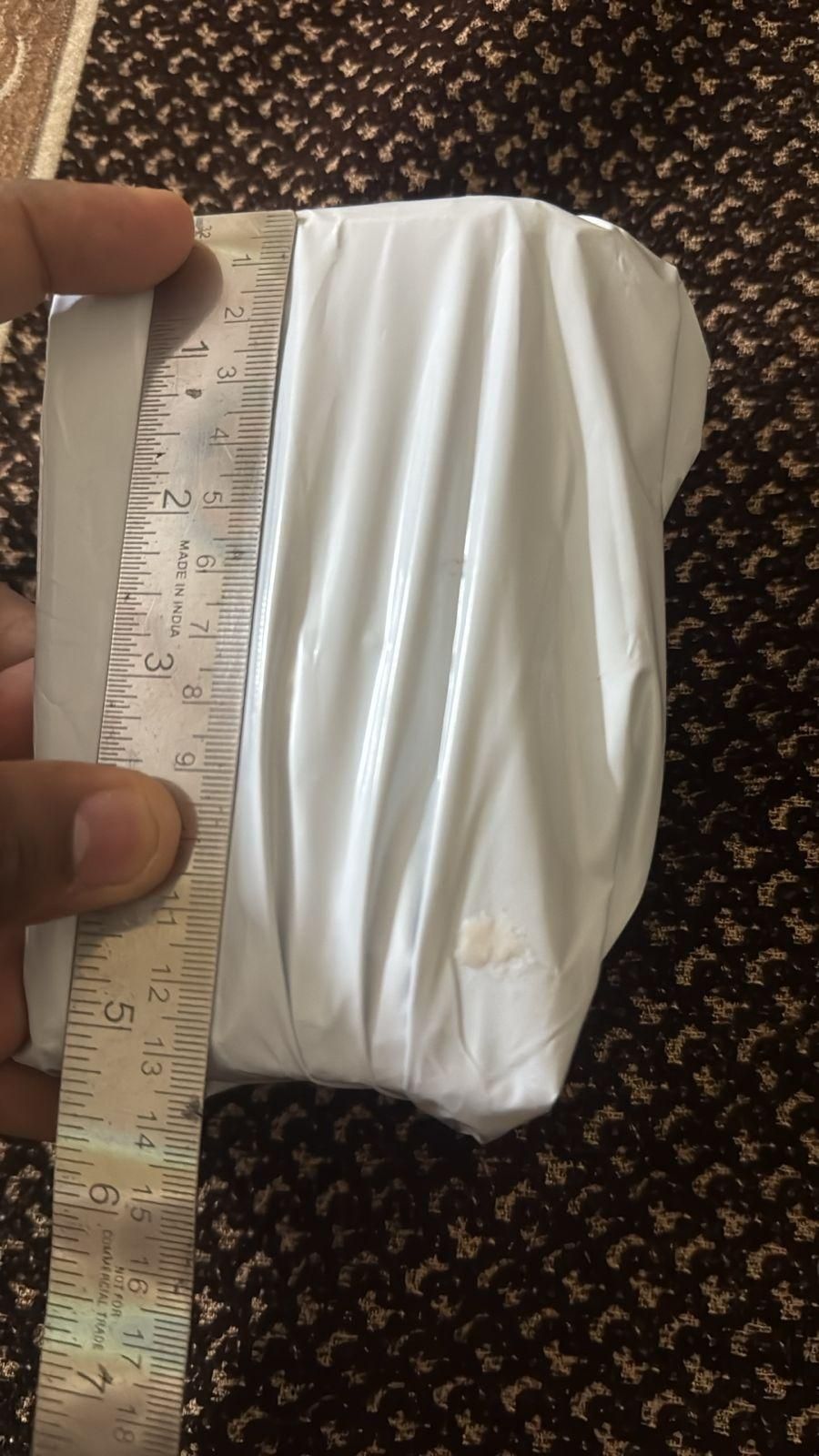 Wrapped package of bee venom skin cream, measuring approximately 6 inches in width