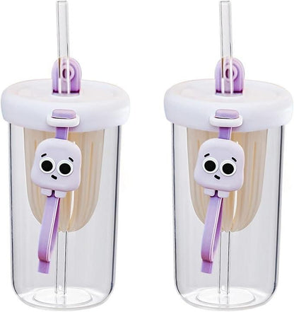 Glass smoothie tumbler with lid featuring a clear body and cute purple skull clip on straw