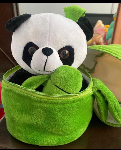 Cute panda plush with bamboo inside a green storage container for kids