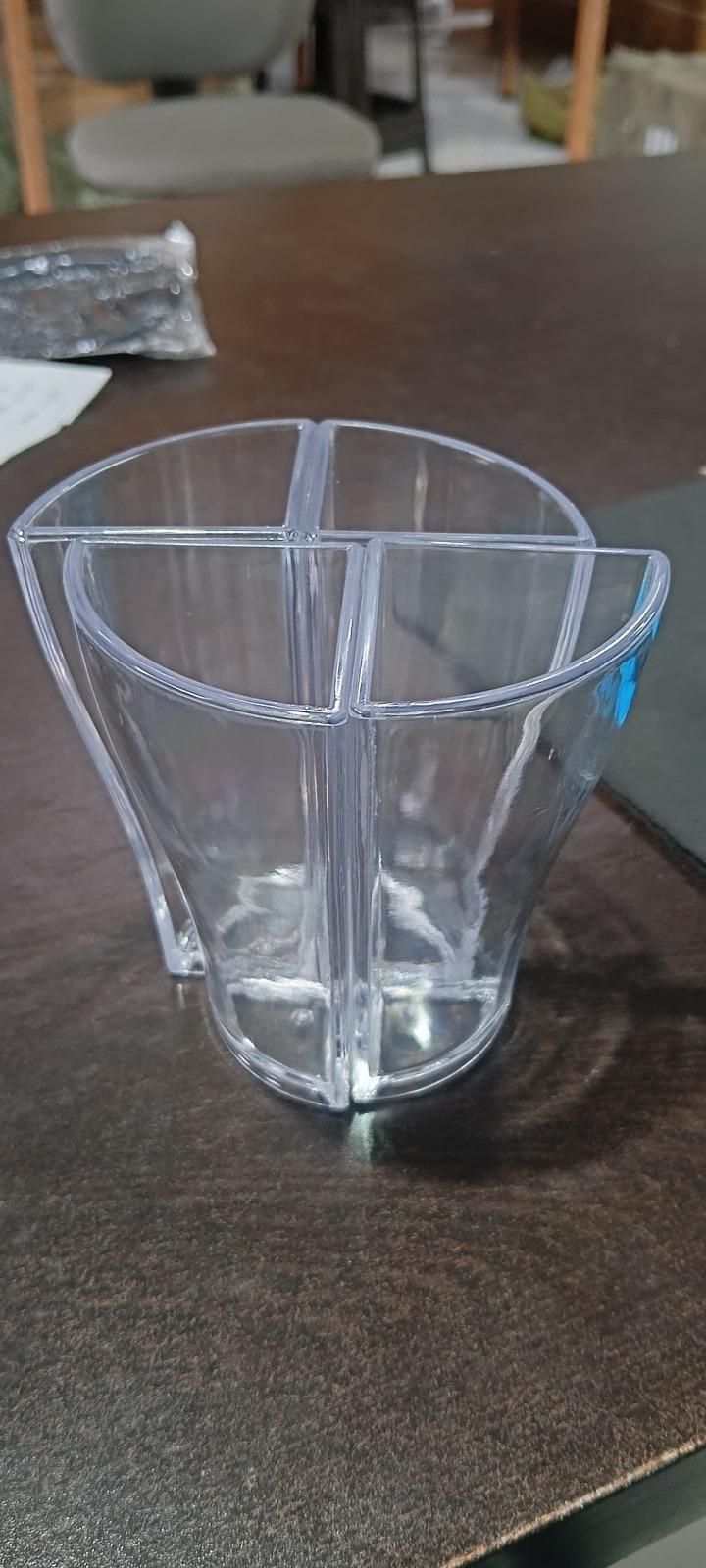 Clear plastic beer splitter mug with four divided compartments for sharing drinks at parties