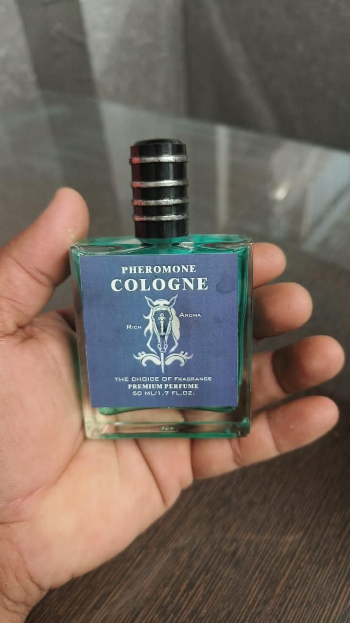 8feb97-4 Pheromone Cologne for Men in a stylish green bottle with a black top