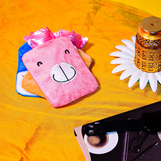 Soft pink hot water bag for cramps with a cute animal design, perfect for soothing discomfort