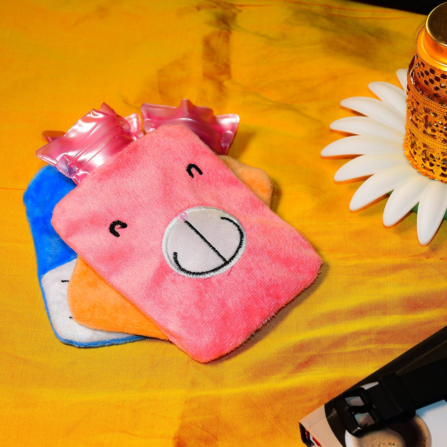 Pink hot water bag for cramps with a cute animal design, perfect for soothing pain relief