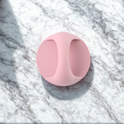 Pink plastic adhesive handle grip for easy attachment on various surfaces