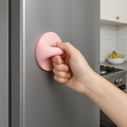 Plastic adhesive handle grip in pink being used to open a refrigerator door