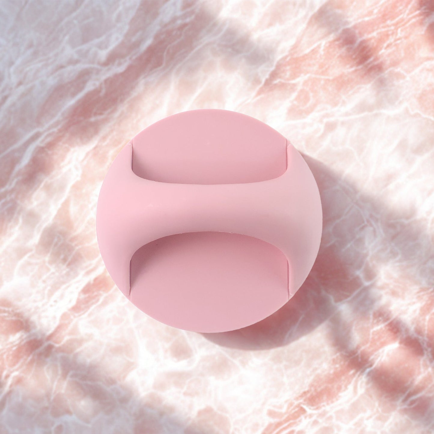 Pink plastic adhesive handle grip designed for comfortable and secure use on various surfaces