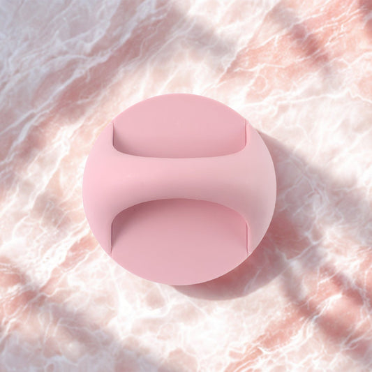 Pink plastic adhesive handle grip designed for comfortable and secure use on various surfaces