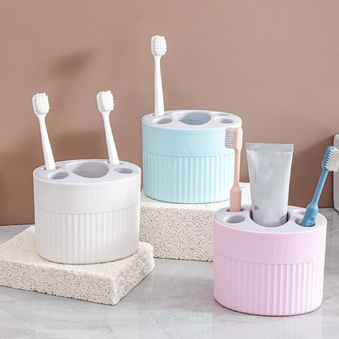 THE GIR FARMER plastic-free storage container in white blue and pink holding toothbrushes and toothpaste