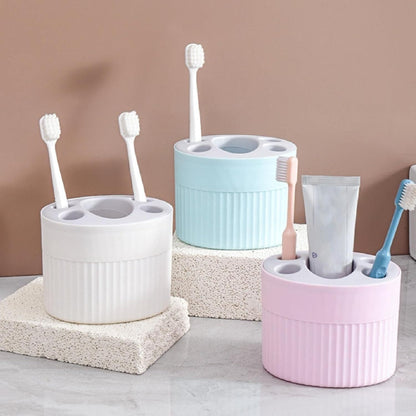 THE GIR FARMER plastic-free storage container in white blue and pink holding toothbrushes and toothpaste
