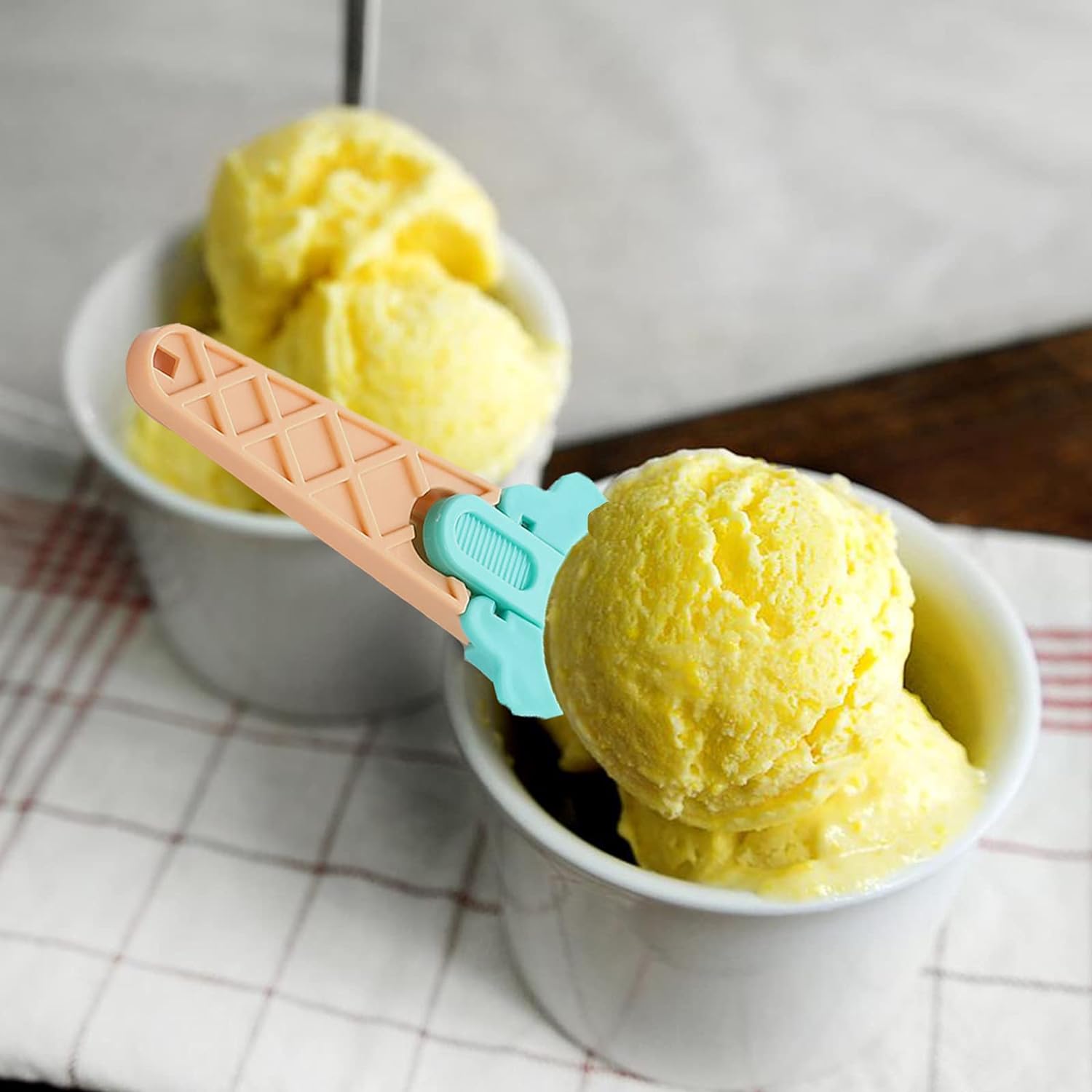 Colorful plastic ice cream scooper set for easy serving of ice cream in bowls