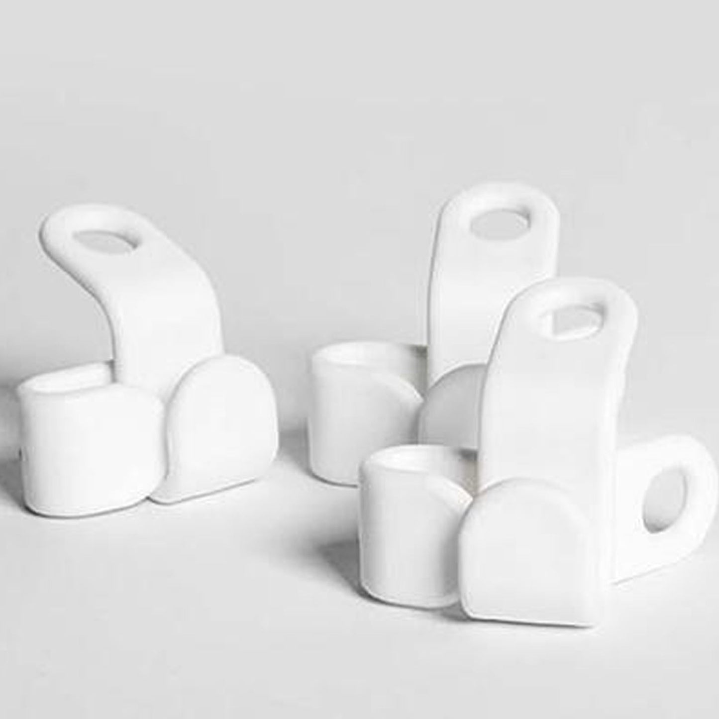 Set of white plastic non-slip clothes hangers designed to keep garments secure and organized