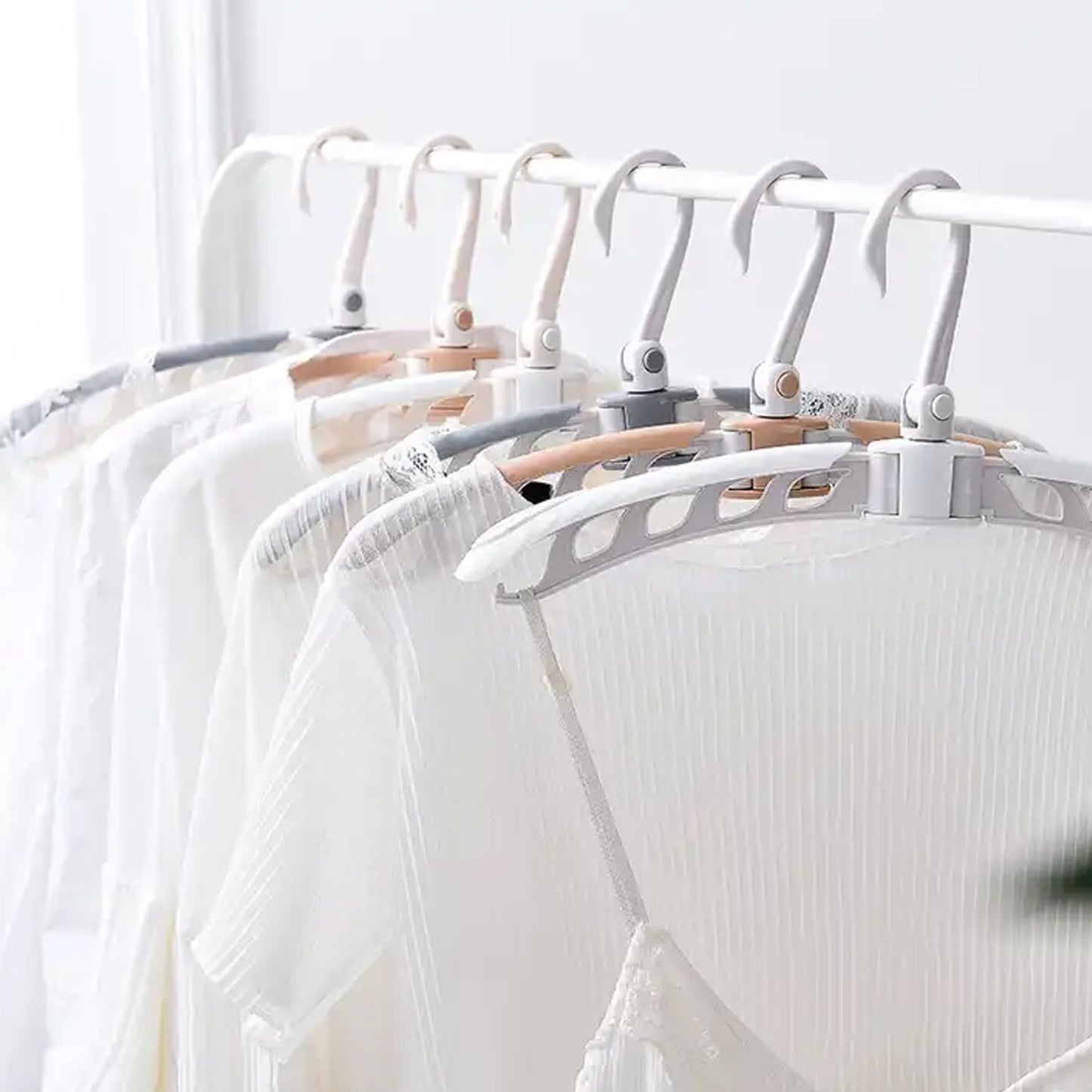 Portable folding clothes hanger with multiple hooks for space-saving laundry organization